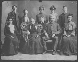 Portrait of Robison family, with Ma and Pa Robison (center) and Lida (back row, 2nd from left).