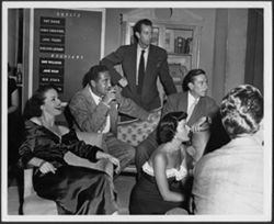 Pat Dane (far left), Sheldon Leonard (2nd from left), Bill Brannan (standing), Hoagy Carmichael, Jane Frazee (sitting), and Bob Stack (far right) on the set of the Pantomime Quiz Time Show.