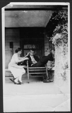 Lida and Howard Carmichael seated on porch, Miami, Florida.