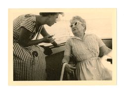Two women talk on boat