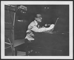 Hoagy Carmichael on soundstage at a piano during the taping of the Saturday Night Revue television program, 1954 or 1955.