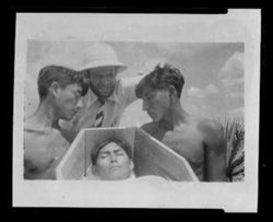 Item 0373a. Close-up of Eisenstein and two men at head of coffin - head of "corpse" also seen.
