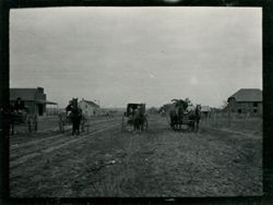 Carriages on dirt road