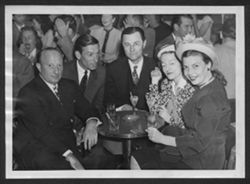 Souvenir photo of Hoagy Carmichael, Ruth Carmichael and three unidentified people at Billy Berg's in Hollywood, California.