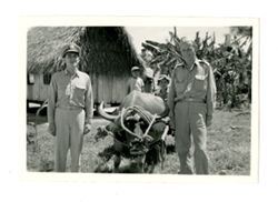 Men and boy with water buffalo