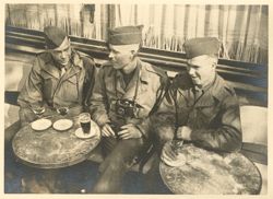 Soldiers enjoying a table in Paris