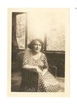 Portrait of Margaret Howard sitting on a porch