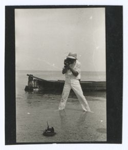 Item 1180. Tissé, Alexandrov and Eisenstein on beach with small alligator and camera. See also Items 514-522 above.