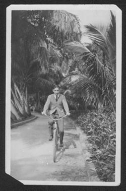 Hoagy Carmichael riding his bicycle.