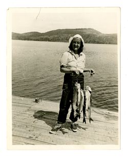 Barbara Howard (née Balfe) posing with fish