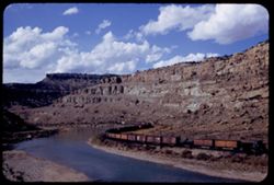 West bound freight train of D & R.G.W. in Horseshoe canyon of Colorado river 28 mi. east of Grand Junction