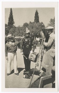 Item 48. From left, Eisenstein, a military drummer, Tissé with camera.