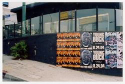 Promotional posters on a building at the intersection of La Cienega and Santa Monica Blvd.