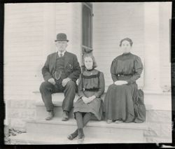 Group of three on porch steps