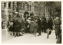 German civilians loading onto truck, Regensberg, Germany