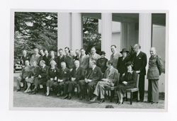 Group of men and women sitting together