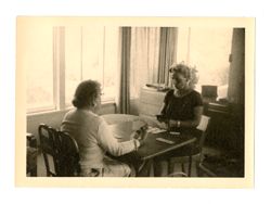 Two women playing cards