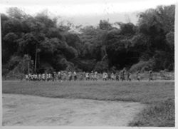 School children playing along road through Gedetarbo