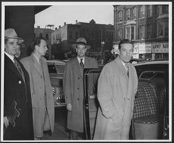 Hoagy Carmichael at Union Station in Indianapolis with unidentified men looking on, one of whom is holding the key to the City of Indianapolis.
