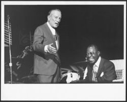 Hoagy Carmichael and Louis Armstrong on stage.