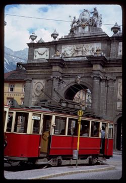 Tram approaching Triumph Pforte. Maria Theresien Str. Innsbruck. X