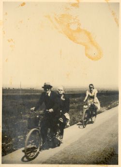 Man and women riding bikes