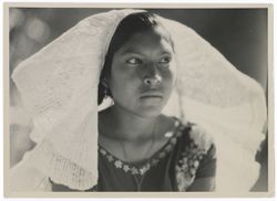 Item 0015. Close-up of Indigenous woman wearing “weepeel” headdress; ¾ profile.