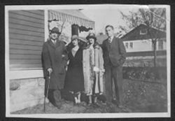 Harry Hostetter, Martha, Lida, and Hoagy Carmichael outside house on Washington Avenue, Bloomington, Indiana.