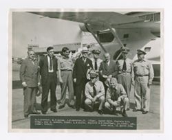 Roy Howard with military officials by plane