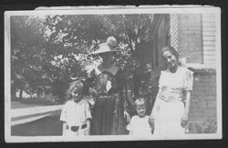 Martha, Lida, Joanne and Georgia Carmichael standing next to a house, summer 1918.