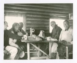 Roy Howard and others in a cabin 2