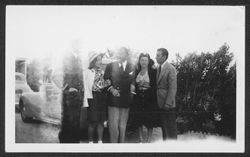 Hoagy Carmichael and Ruth Carmichael posing outside with three unidentified people.