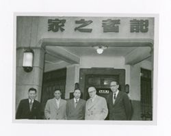 Roy Howard and others outside of a building 2