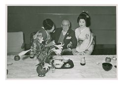 Roy W. Howard and two women in Tokio, Japan