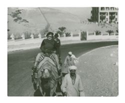 Peg Howard riding a camel