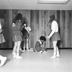 IU South Bend cheerleaders talk at practice, 1970s