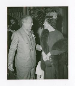 Roy Howard talking with Mrs. P. C. Spender
