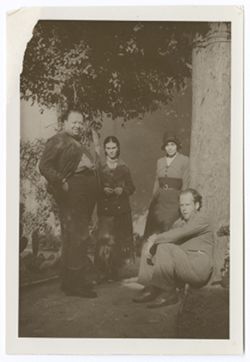 Item 0506. Two similar shots of Eisenstein, Diego Rivera, Frida Kahlo, and an unidentified women beside a large tree in a garden or patio. On back, written in blue ink: "Diego Rivera L/Sergei Eisenstein R."