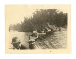 Groups of people in canoes