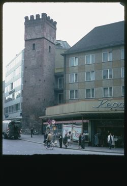 View up Rindmarkt -  old tower amid new buildings Oberanger and Rosental Str.