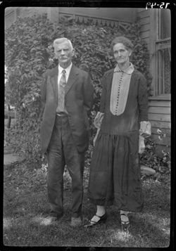 Mr. and Mrs. Greenberry Snyder, standing
