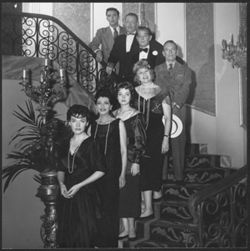Hoagy Carmichael (fourth from top) standing with unidentified people on a stairway.