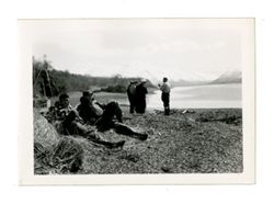 Men on shore of Uyak Bay