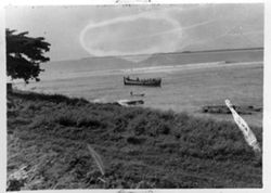 A large and a small boat along Liberian coast