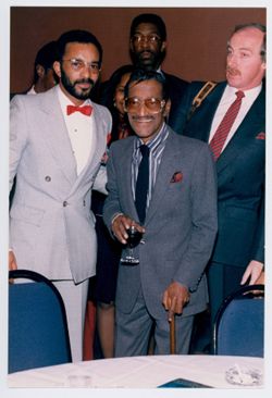 Unidentified men with Sammy Davis Jr.