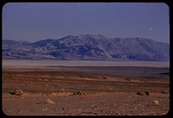 View SE toward Black Mtns. from Sand dune junction across salt flat in late afternoon Death Valley