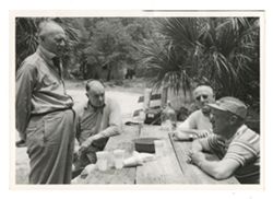 Men sitting at a picnic table