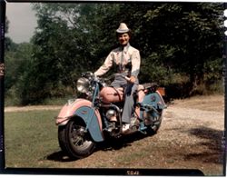 Woman on motorcycle, "Pink Lady"