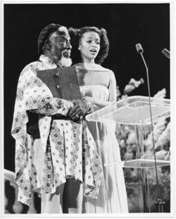 Clarence Muse at podium with Debbie Allen