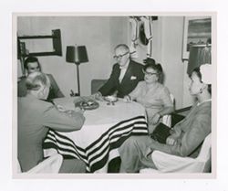Roy and Margaret Howard sitting with others